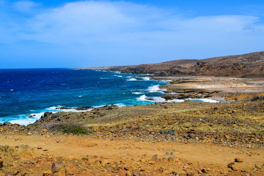 Arikok Natural Park on the island of Aruba in the Caribbean Sea with deserts and ocean waves on the rocky coast