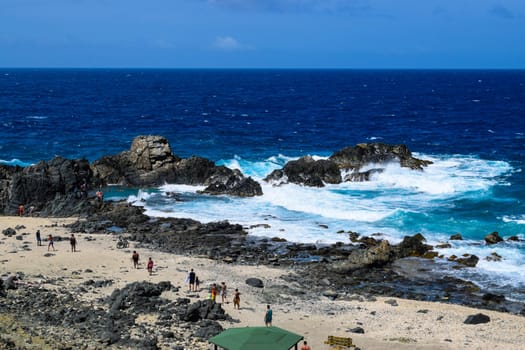 Arikok Natural Park on the island of Aruba in the Caribbean Sea with deserts and ocean waves on the rocky coast