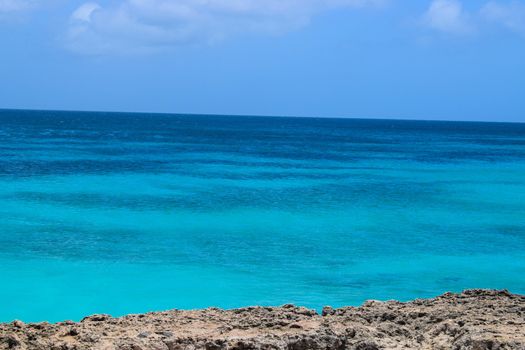 Arikok Natural Park on the island of Aruba in the Caribbean Sea with deserts and ocean waves on the rocky coast