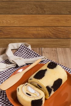 Cake roll with cow-skin pattern inserted with fresh milk cream.