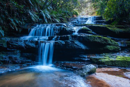 Water cascading over rocks early in the morning in Leura Cascades, New South Wales, Australia