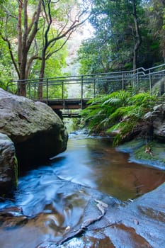 Water cascading over rocks early in the morning in Leura Cascades, New South Wales, Australia