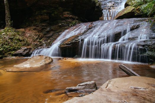 Water cascading over rocks early in the morning in Leura Cascades, New South Wales, Australia