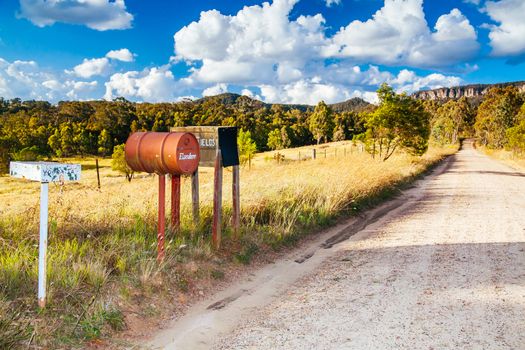 Letterboxes line a dirt road in Megalong Valley, Blue Mountains, Australia