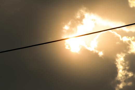 Cables of electric on sunset sky background in evening.