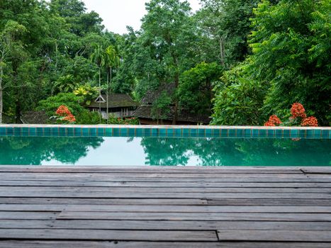 Swimming pool in beautiful park at Northern resort of Thailand.