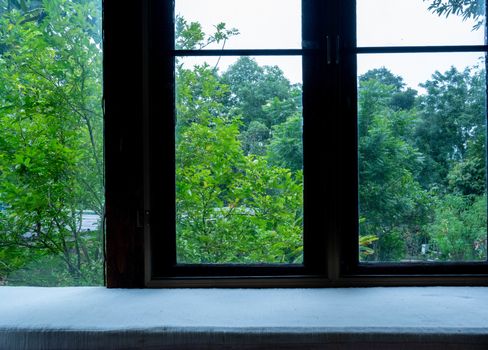 Vintage wooden window frame with curtain decoration interior of room.