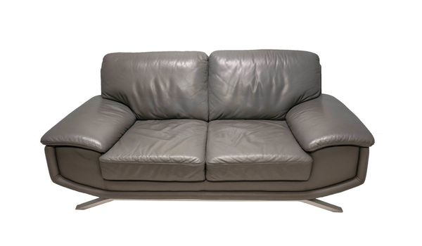 Front view of grey sofa on yellow background.