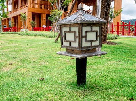 Wooden Lamps with lighting from solar panel in the garden of Hinoki land; Japanese building style for travel in Chaiprakarn district Chiang Mai,Thailand.