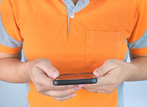 Close up of young woman using smartphone in room.