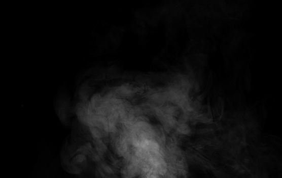 White smoke on dark background.