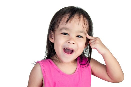 Adorable Asian child thinking and wearing pink dress isolated on a white background.