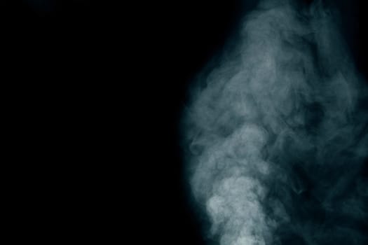 White smoke on dark background.