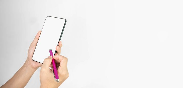 Close-up of hand holding smartphone with pen isolated on white background with space for your text.