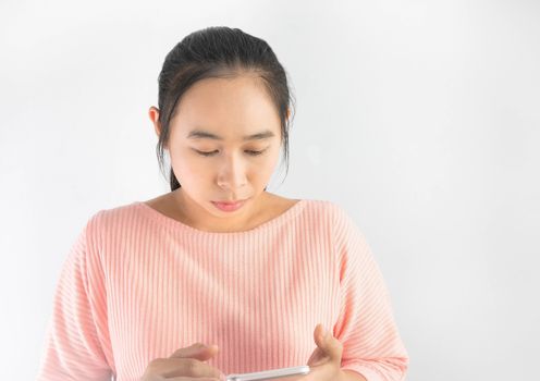 Portrait of young Asian woman using mobile phone, Isolated on white background.