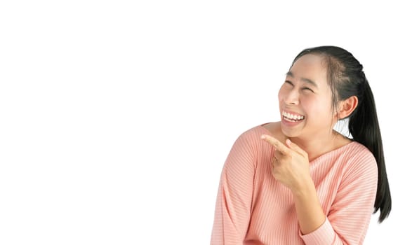 Happy Asian woman smiling cheerfully and pointing finger to empty space, Isolated on white background.