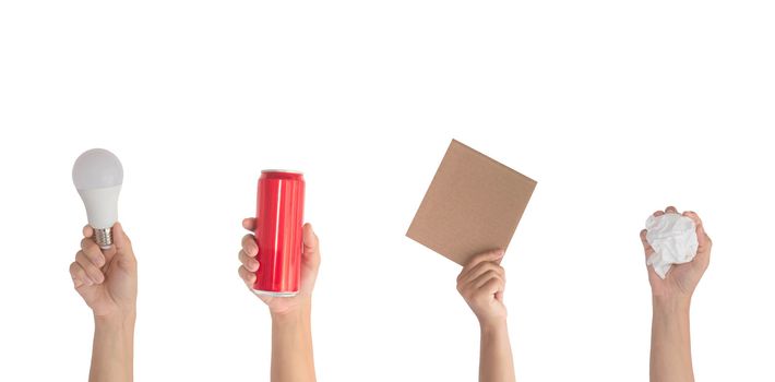 Close up hands hold set of recycling paper, aluminum can, light bulb objects isolated on white background. Ecology environment protection concept.