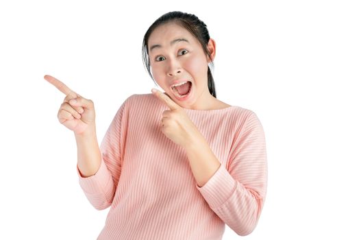 Wow and surprised face of young Asian woman wear pink t-shirt with hand point on empty space.