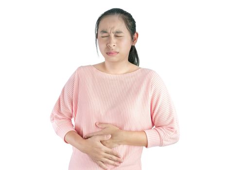 Unhealthy Asian woman suffering from stomachache and keeps hands on belly, Isolated on white background.