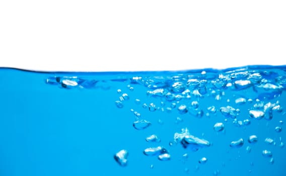 Air bubbles rising up to surface in blue pure water. Abstract background.