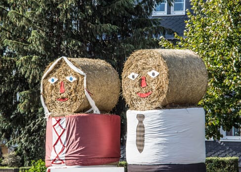 Bales of straw decorated as dolls
