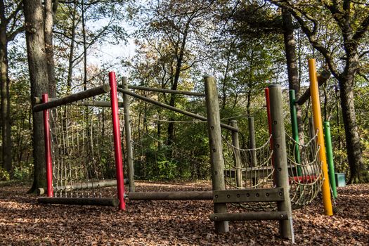 Children's playground with sports equipment in the deciduous forest