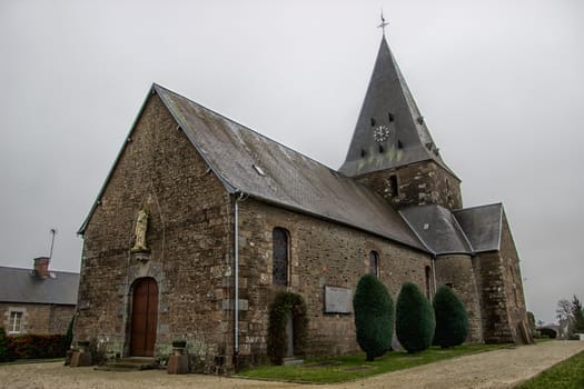 Old church in a Normandy village in winter