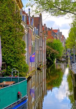 The canals and waterways in the city of Delft in The Netherlands on a sunny day.