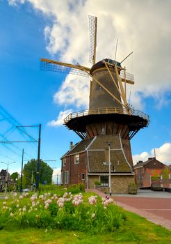 A windmill in the city of Delft in The Netherlands on a sunny day.