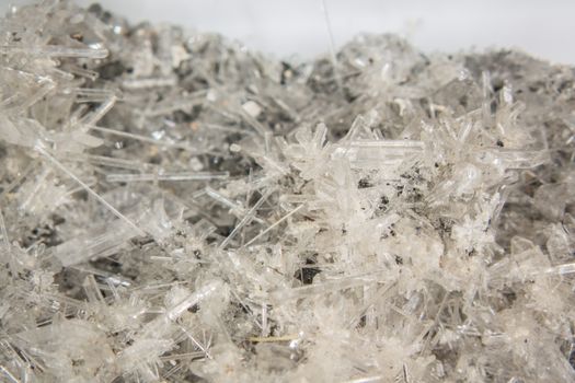 Selenite crystal needles on rock