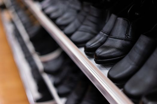 leather shoes on the shelf in shop.fashion and work shoes for men.