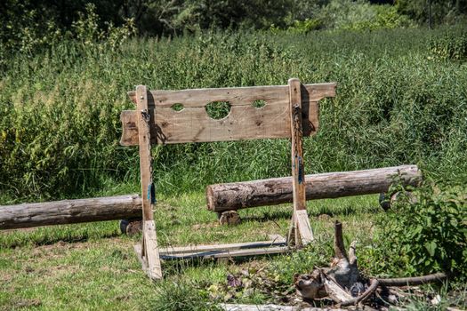 antique pillory on village meadow