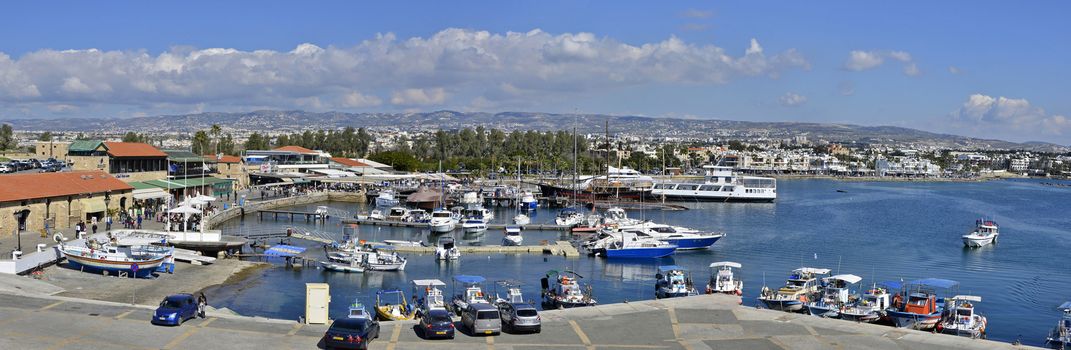 PAPHOS, SOUTHERN CYPRUS, JULY 2016  the harbor on a busy summer day with many people and boats and much holiday activity.