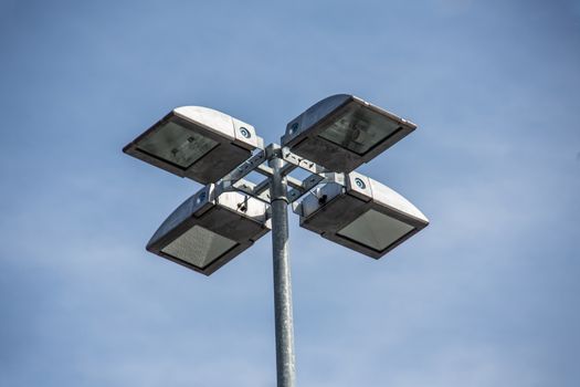 high headlight mast against a blue sky