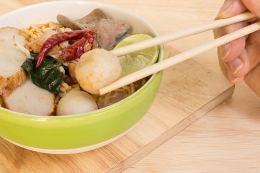 Tom Yum Spicy Soup Noodle with Fish Ball and Pork : Popular Thai Food