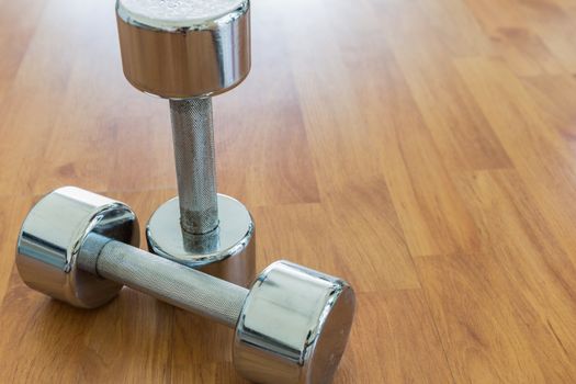 Dumbbells on Wooden Floor