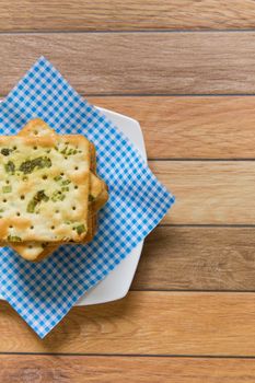 Stack of salty vegetable flavored crackers.