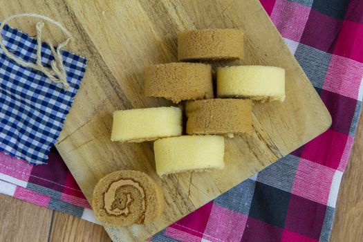 Freshly made slices of vanilla and coffee cake rolls.