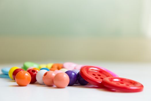 These colorful buttons and beads are for kids to practice their sewing skill.