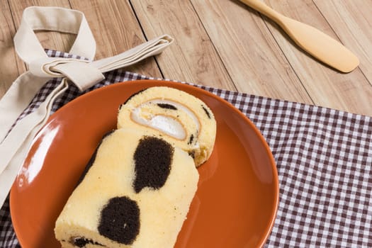 Cake roll with cow-skin pattern inserted with fresh milk cream.