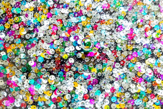 Water drop, droplet, raindrop of colorful button background