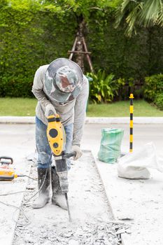 Ongoing roadwork under construction using jackhammer equipment
