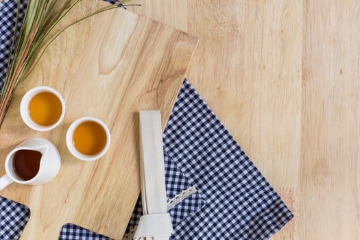 Wood Texture Background Decorated by Cutting Plate and Cups of Tea