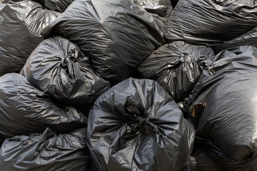 Big Stack of Black Garbage Bags
