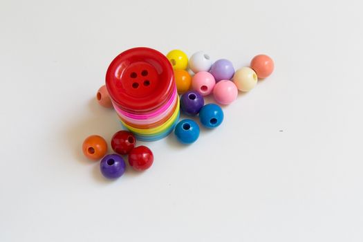 These colorful buttons and beads are for kids to practice their sewing skill.