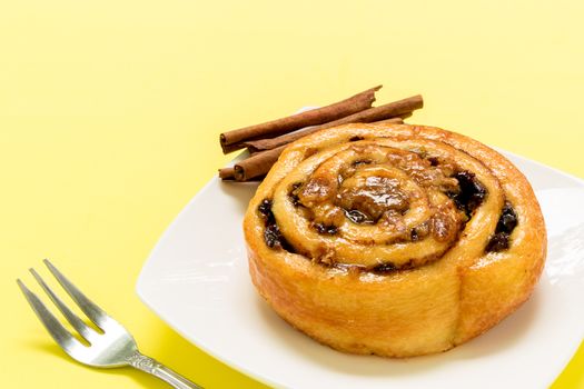 Cinnamon roll freshly made to eat with tea for break.