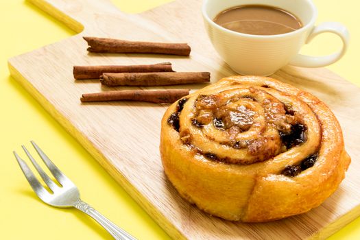 Cinnamon roll freshly made to eat with coffee for break.