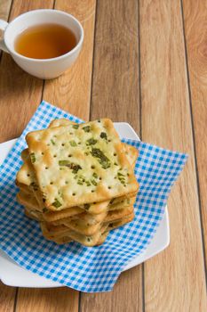 Stack of salty vegetable flavored crackers.