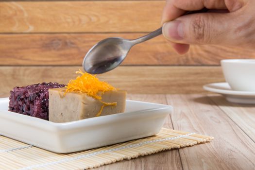Sweet Thai recipe made with black rice, sugar, and egg.