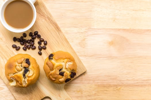 Homemade muffin for breakfast eaten with coffee.